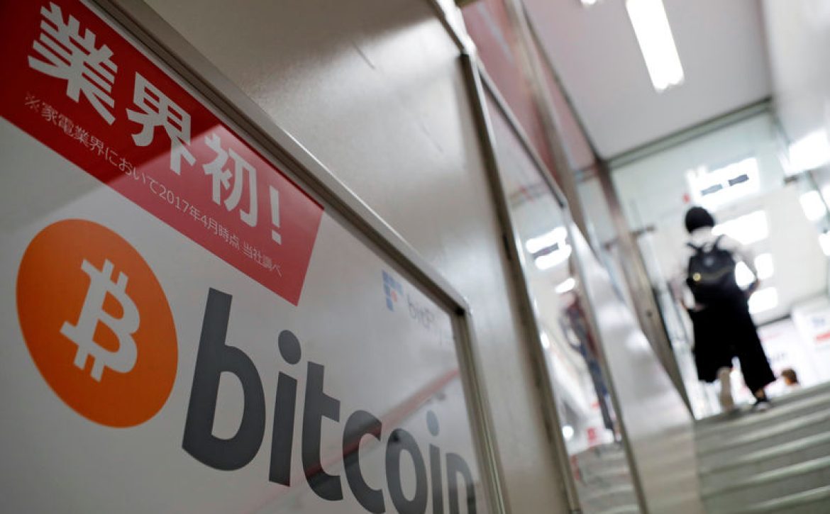 Logo of Bitcoin is seen on an advertisement of an electronic shop in Tokyo